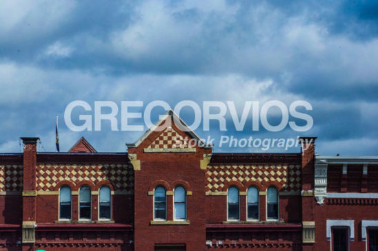 Brick Building with Clouds