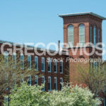 Mill building with tower in spring