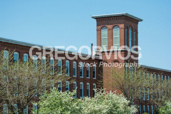 Mill building with tower in spring