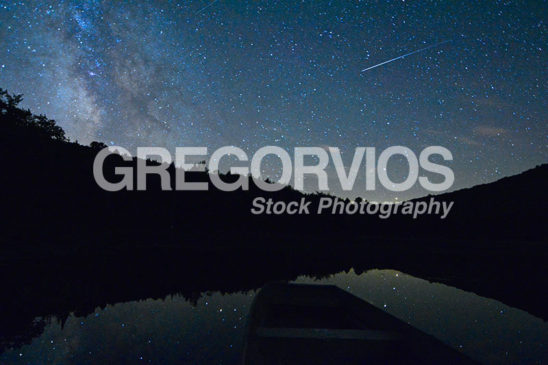 Meteor fly's over lake with Milky Way in the sky